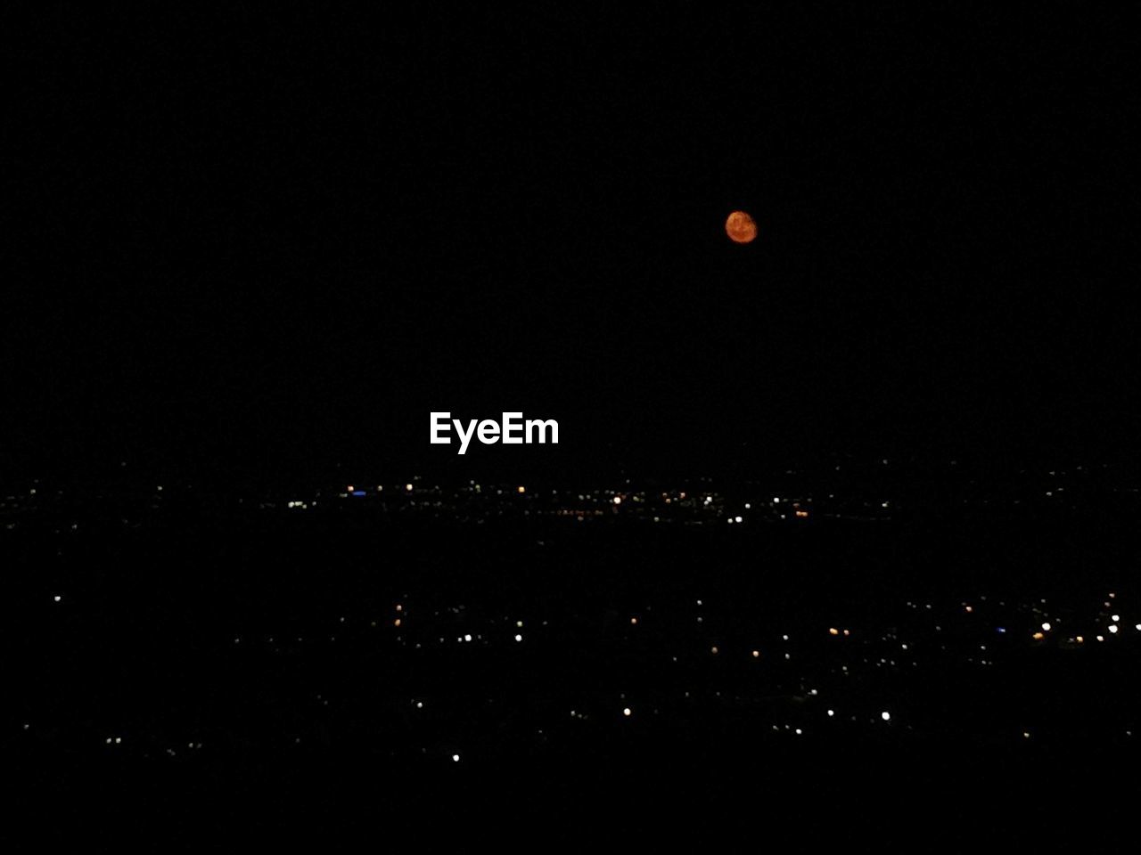 SCENIC VIEW OF ILLUMINATED MOON AT NIGHT