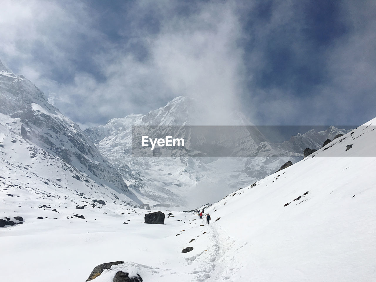 Scenic view of snowcapped mountains against sky