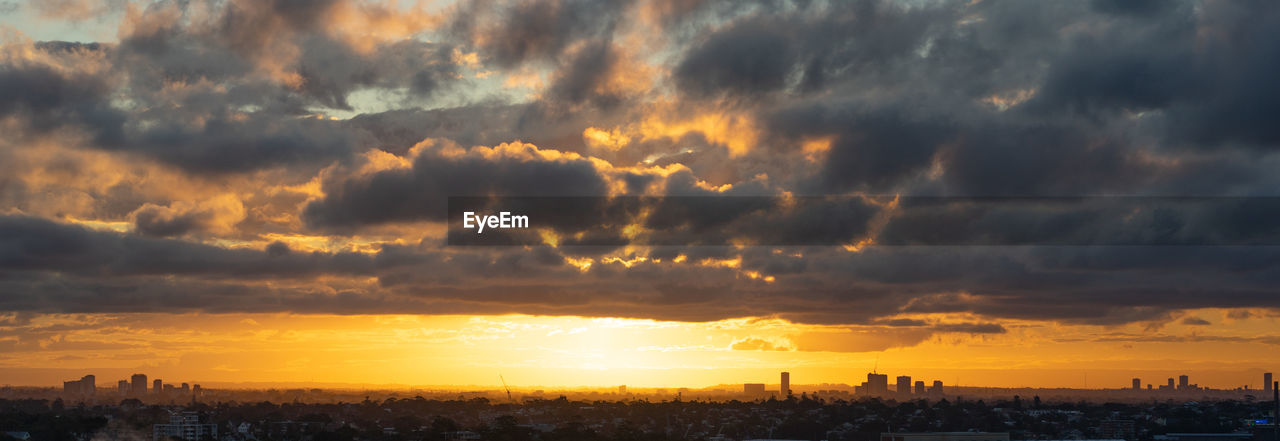 SCENIC VIEW OF BUILDINGS AGAINST SKY DURING SUNSET