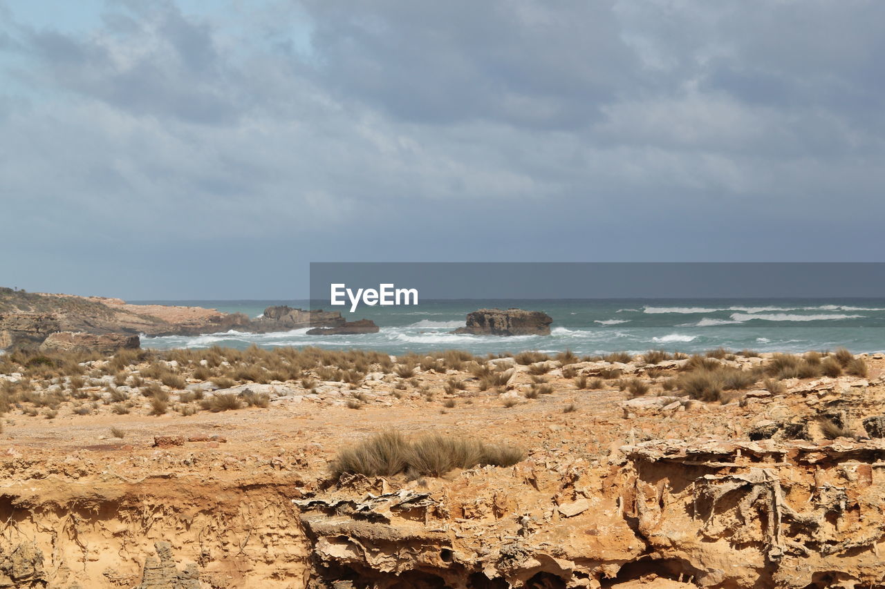 Scenic view of beach against sky