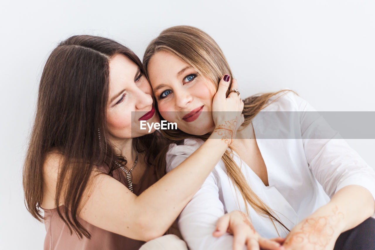 PORTRAIT OF A HAPPY WOMAN WITH MOTHER