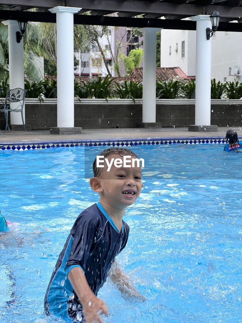 child, swimming pool, childhood, water, men, happiness, smiling, leisure centre, enjoyment, swimming, lifestyles, water sports, emotion, sports, one person, nature, vacation, recreation, leisure activity, fun, cheerful, portrait, day, outdoors, motion, joy, positive emotion, innocence, toddler, water park, female, wet, swimwear