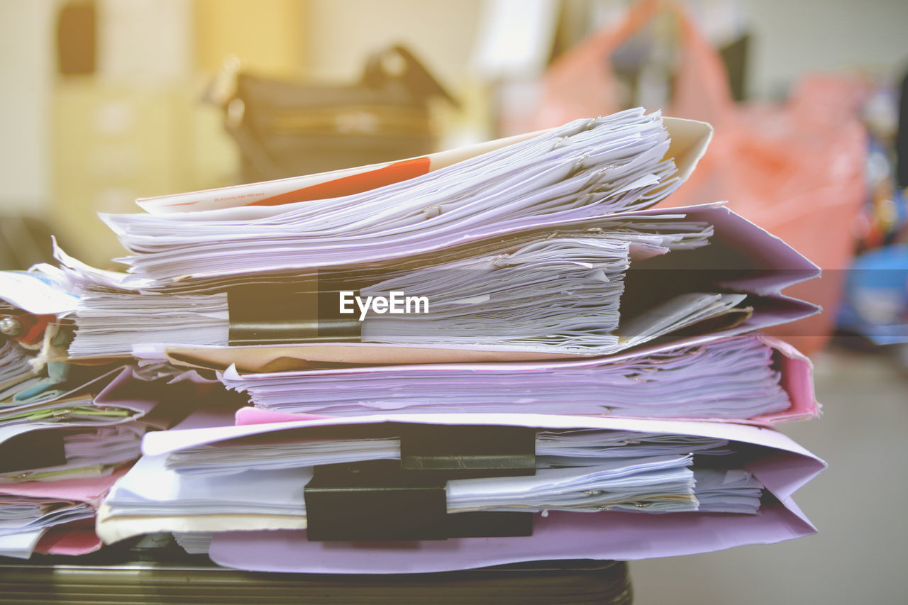 Close-up of files on table at office