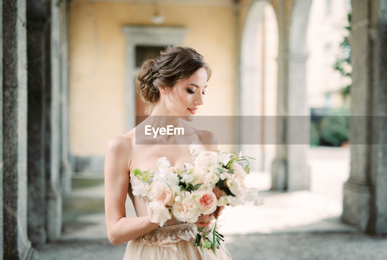 portrait of young woman with bouquet