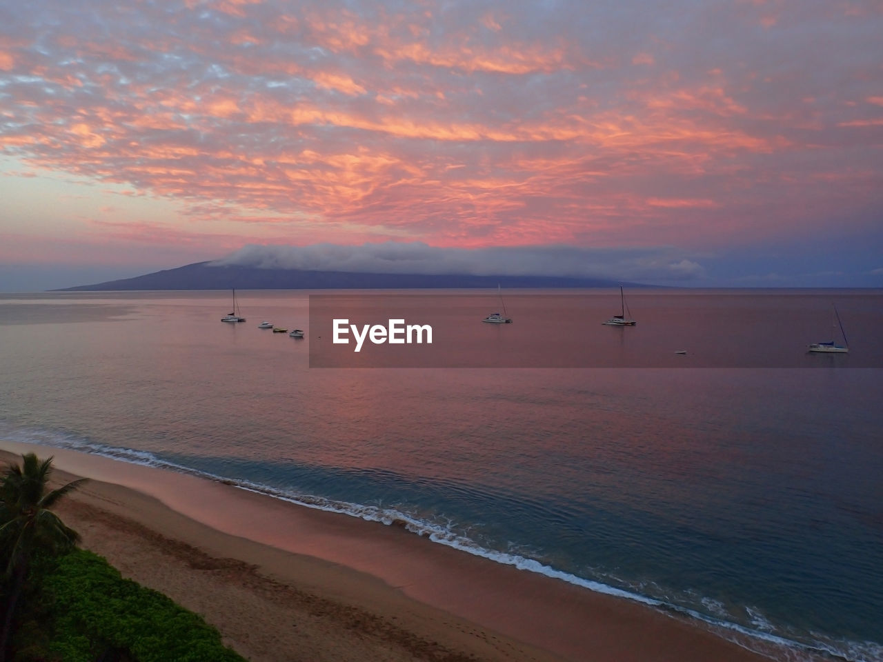 Scenic view of sea against sky at sunset