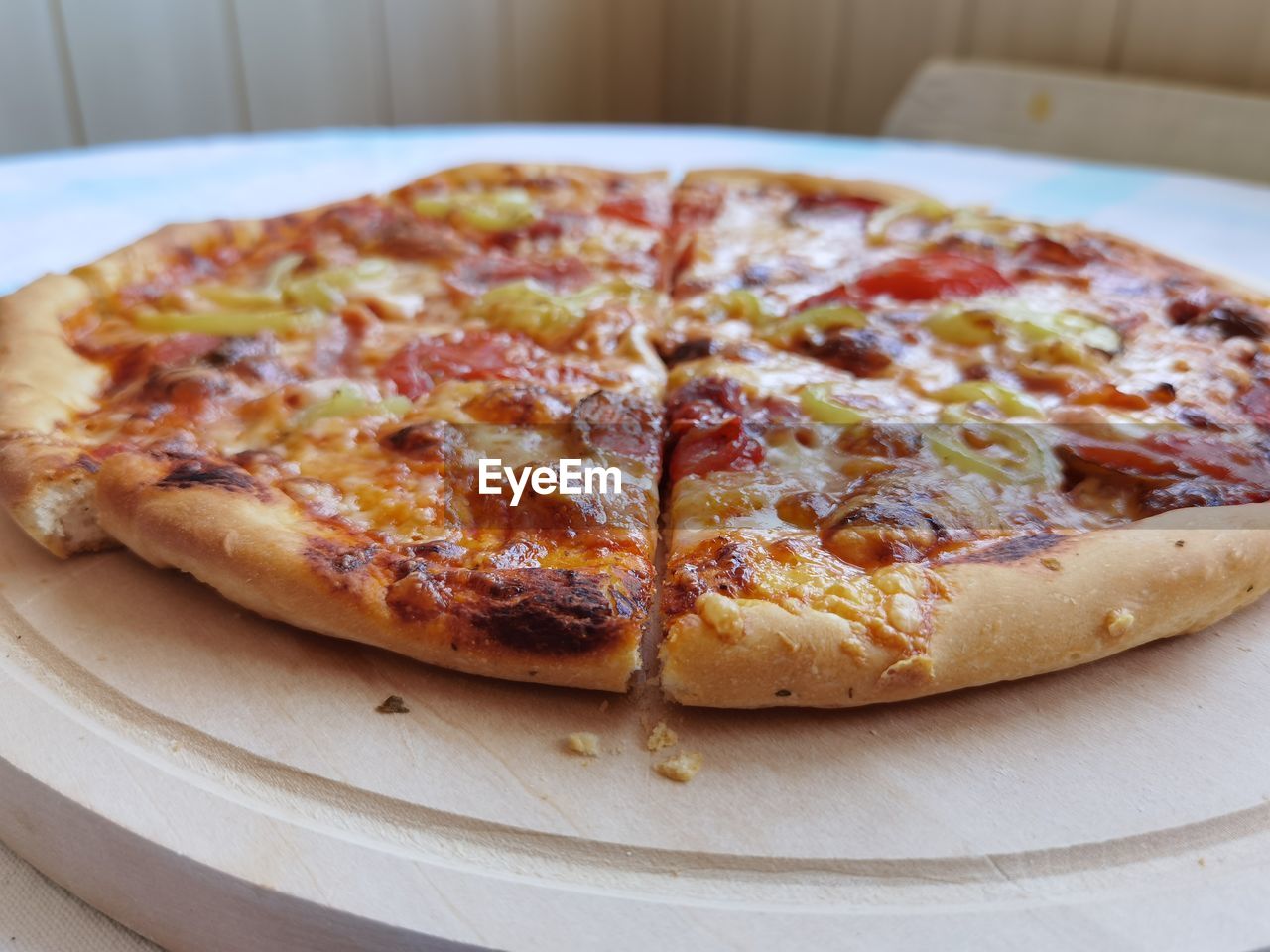 CLOSE-UP OF PIZZA SERVED ON TABLE