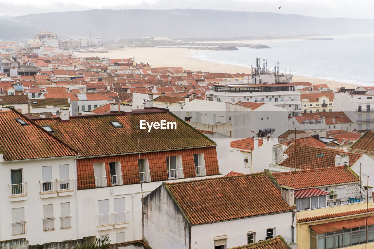 Top view of the streets with white houses and orange tiled roofs an ancient portuguese city 