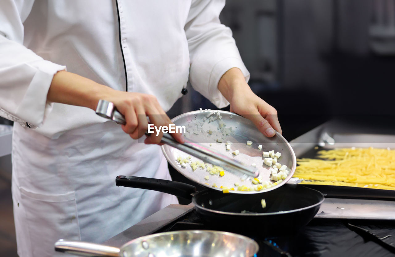 midsection of man preparing food on table