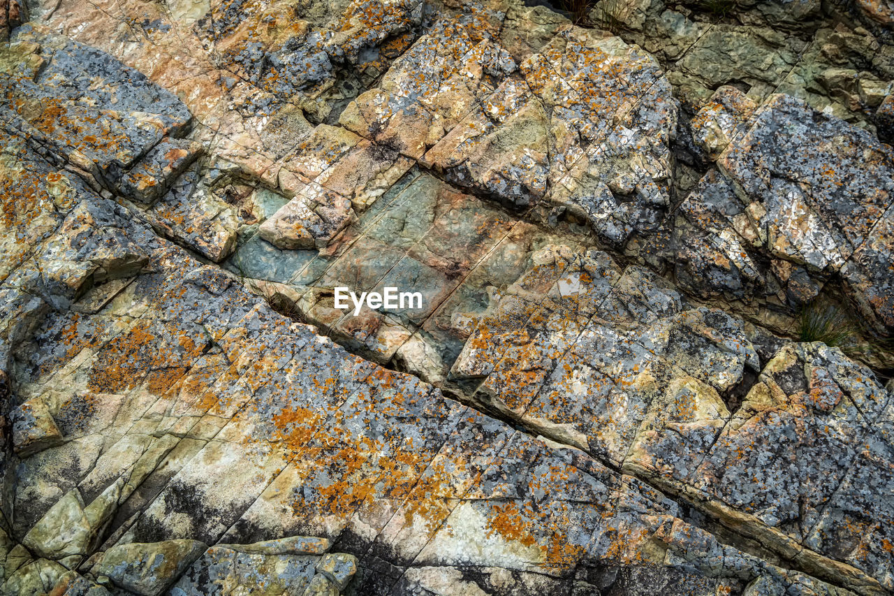 Various rock formations captured close up in geoje island, sinseondae, south korea.