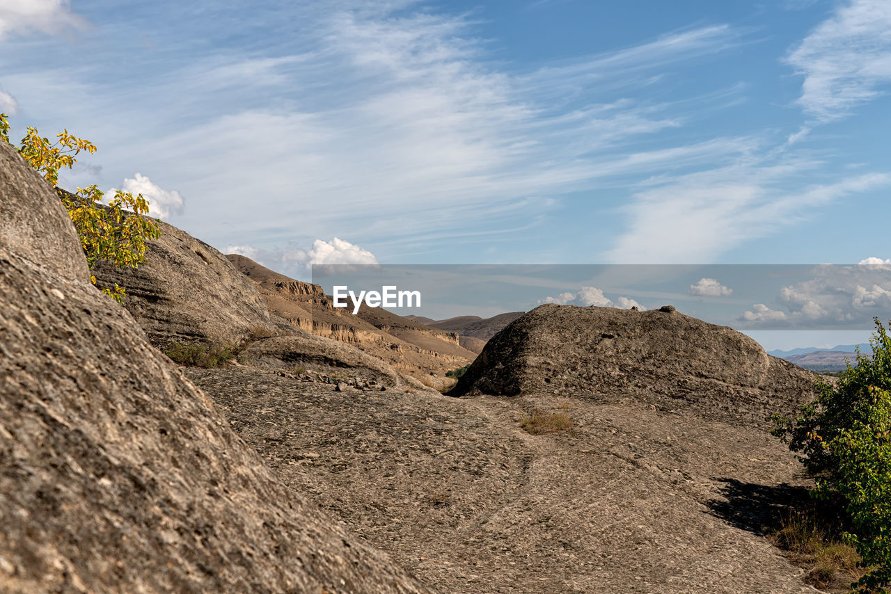 Scenic view of rocky mountains against sky