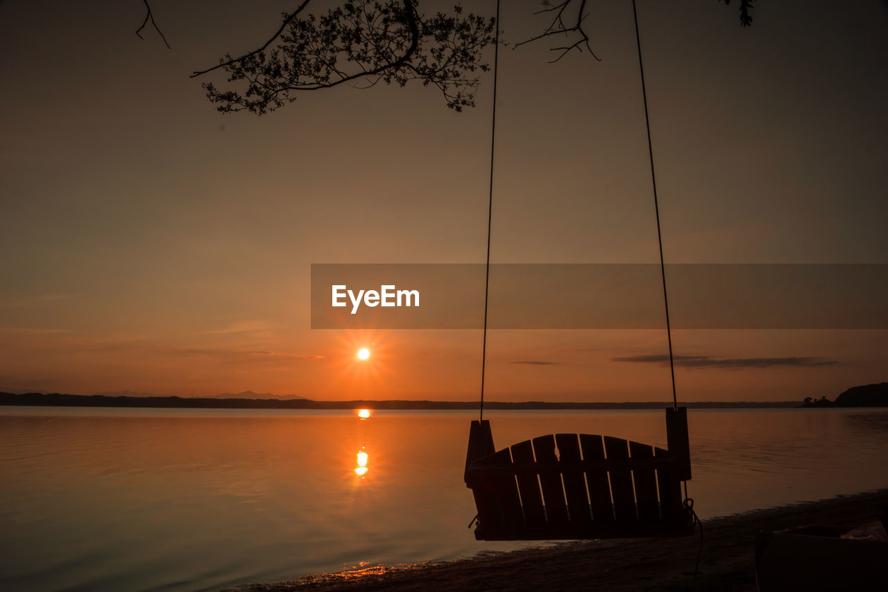 SUNSET OVER CALM SEA