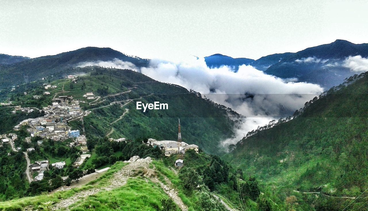 SCENIC VIEW OF TREE MOUNTAINS AGAINST CLEAR SKY