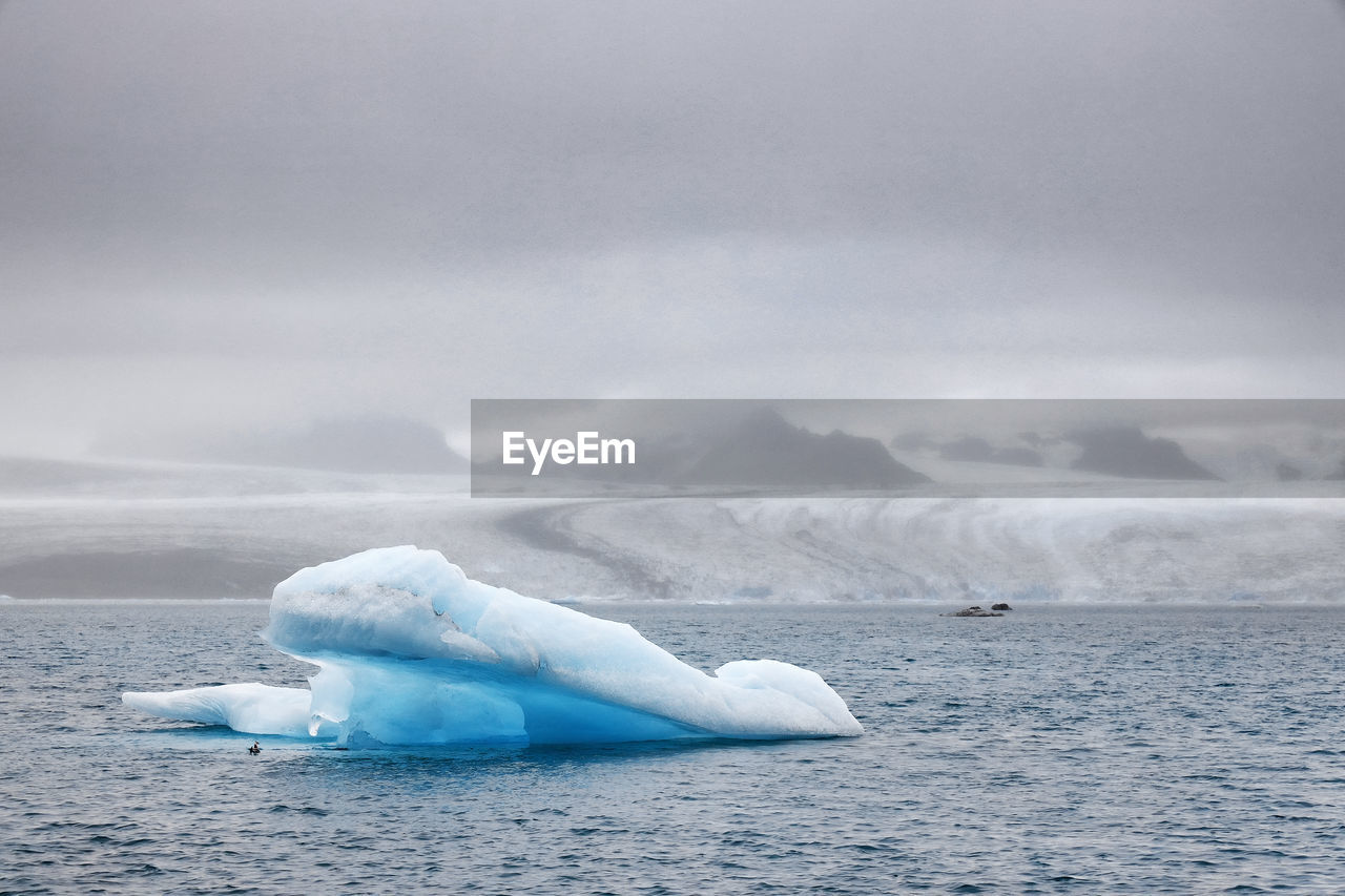 High angle view of iceberg in sea