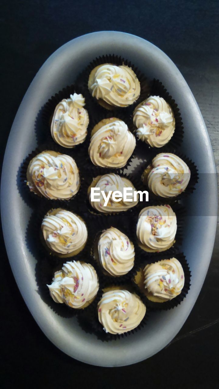 Directly above shot of cupcakes in tray