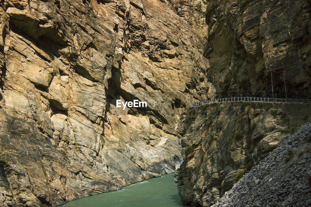 Scenic view of river amidst cliff