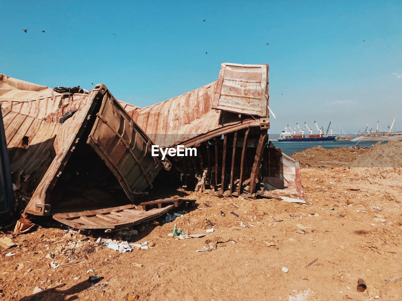 Abandoned shipping containers from the beorut explosion against clear sky