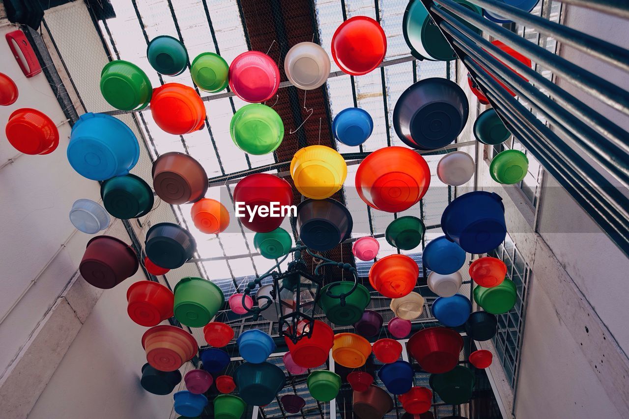 LOW ANGLE VIEW OF MULTI COLORED DECORATIONS