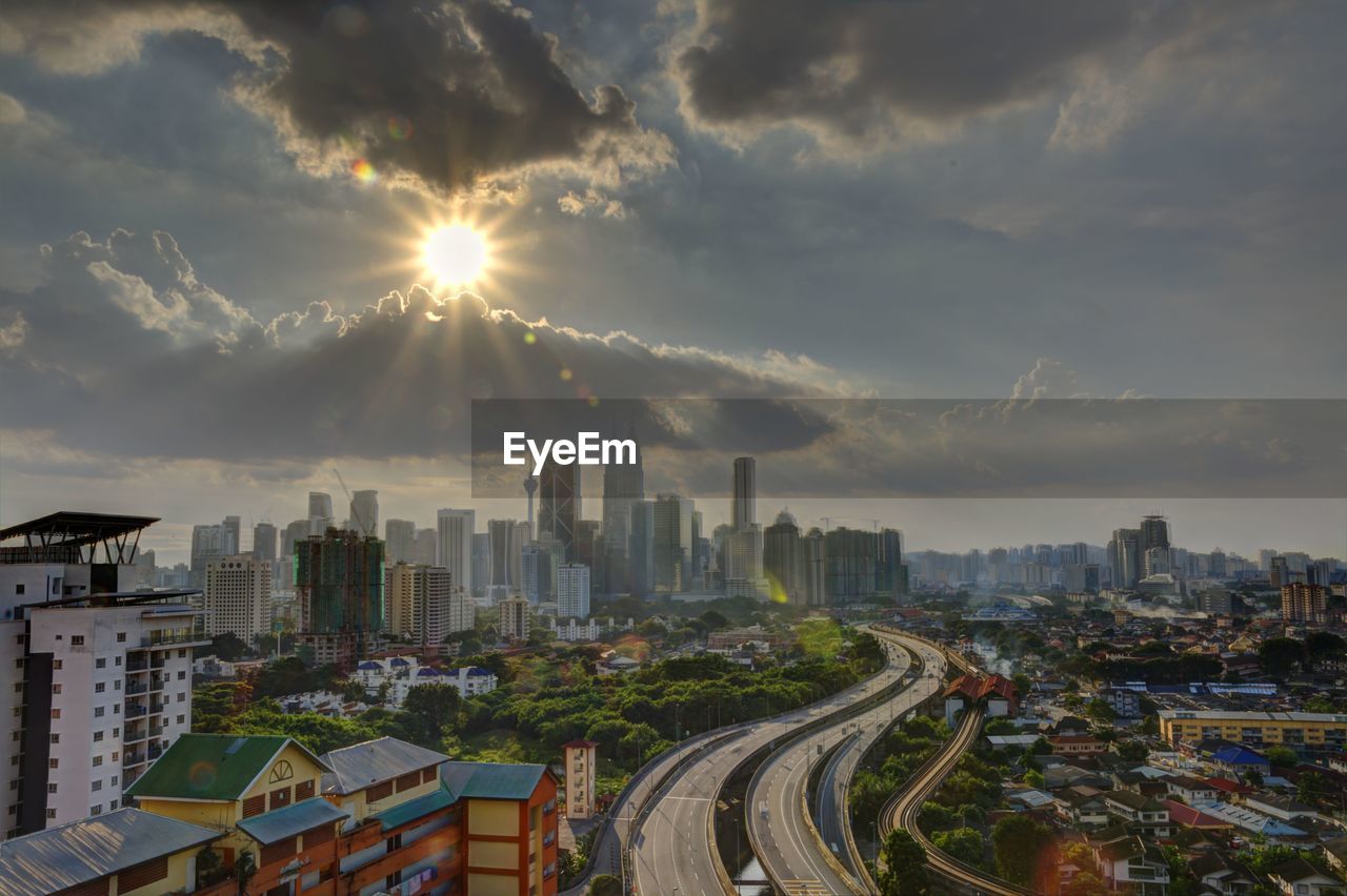 Scenic view of cityscape against sky during sunset