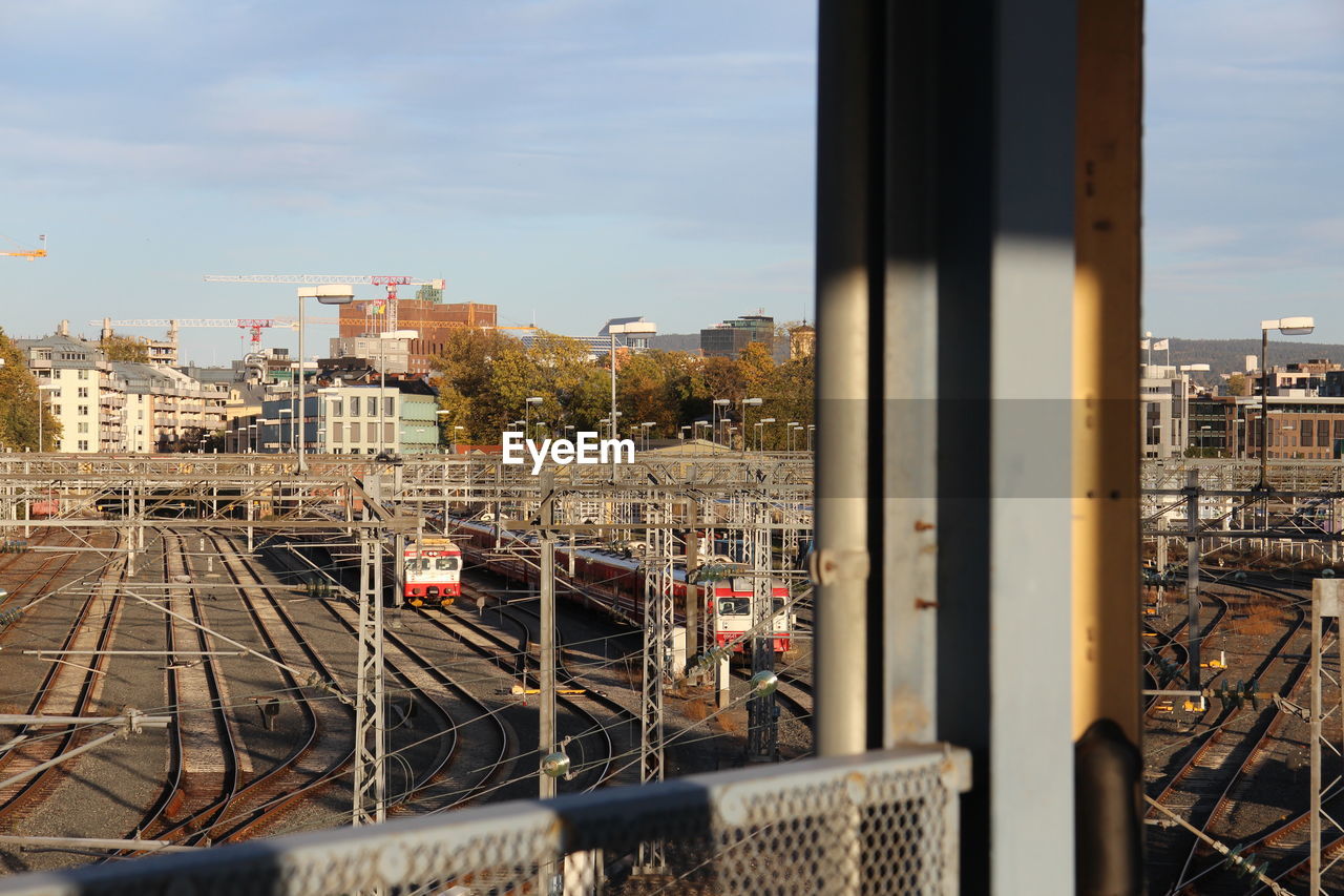 High angle view of train against buildings in city