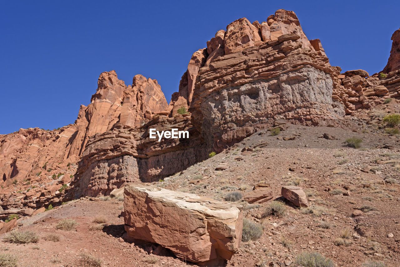 Dramatic red rock cliffs in the desert of capitol reef national park in utah