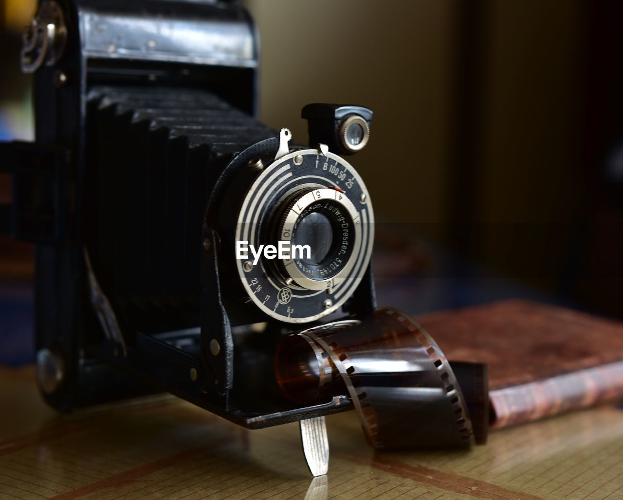 Close-up of camera on table