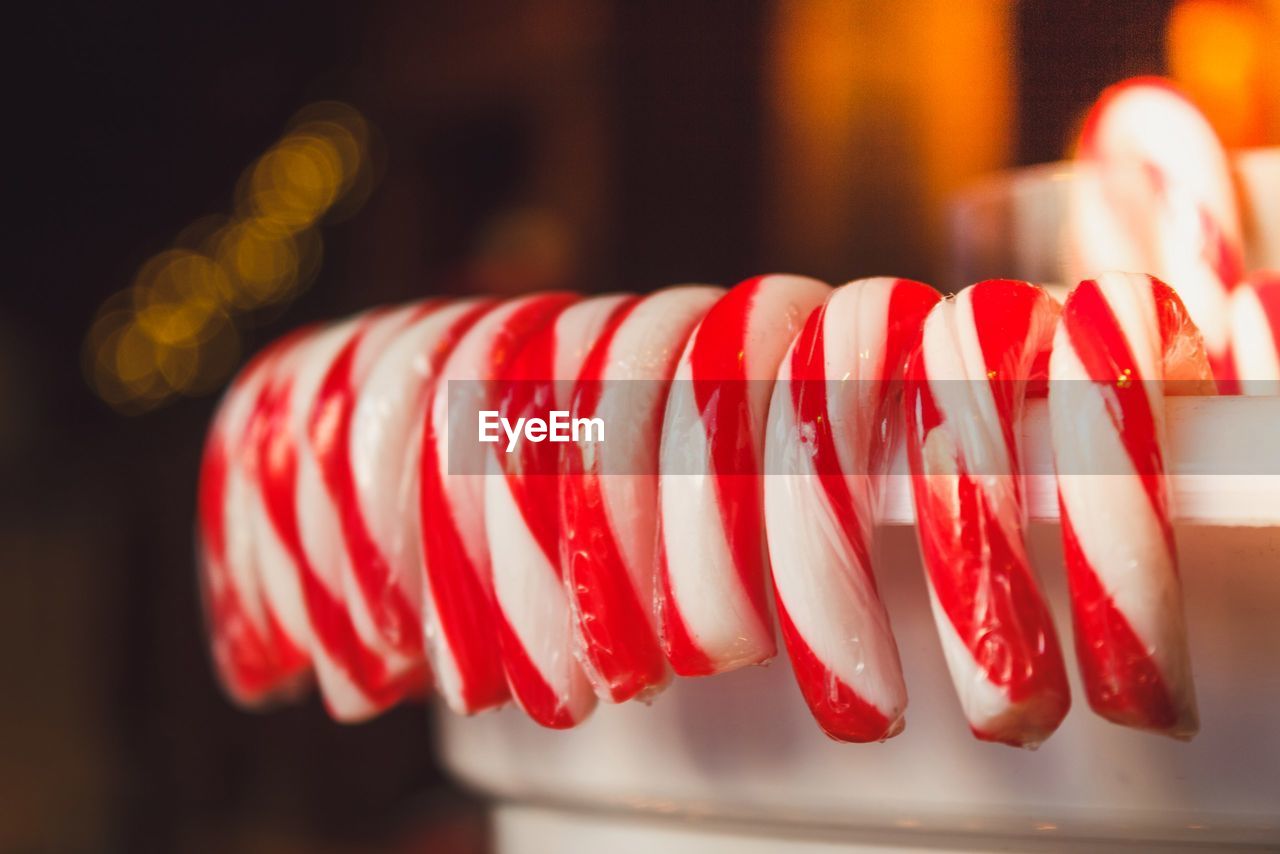 Close-up of candy canes in container