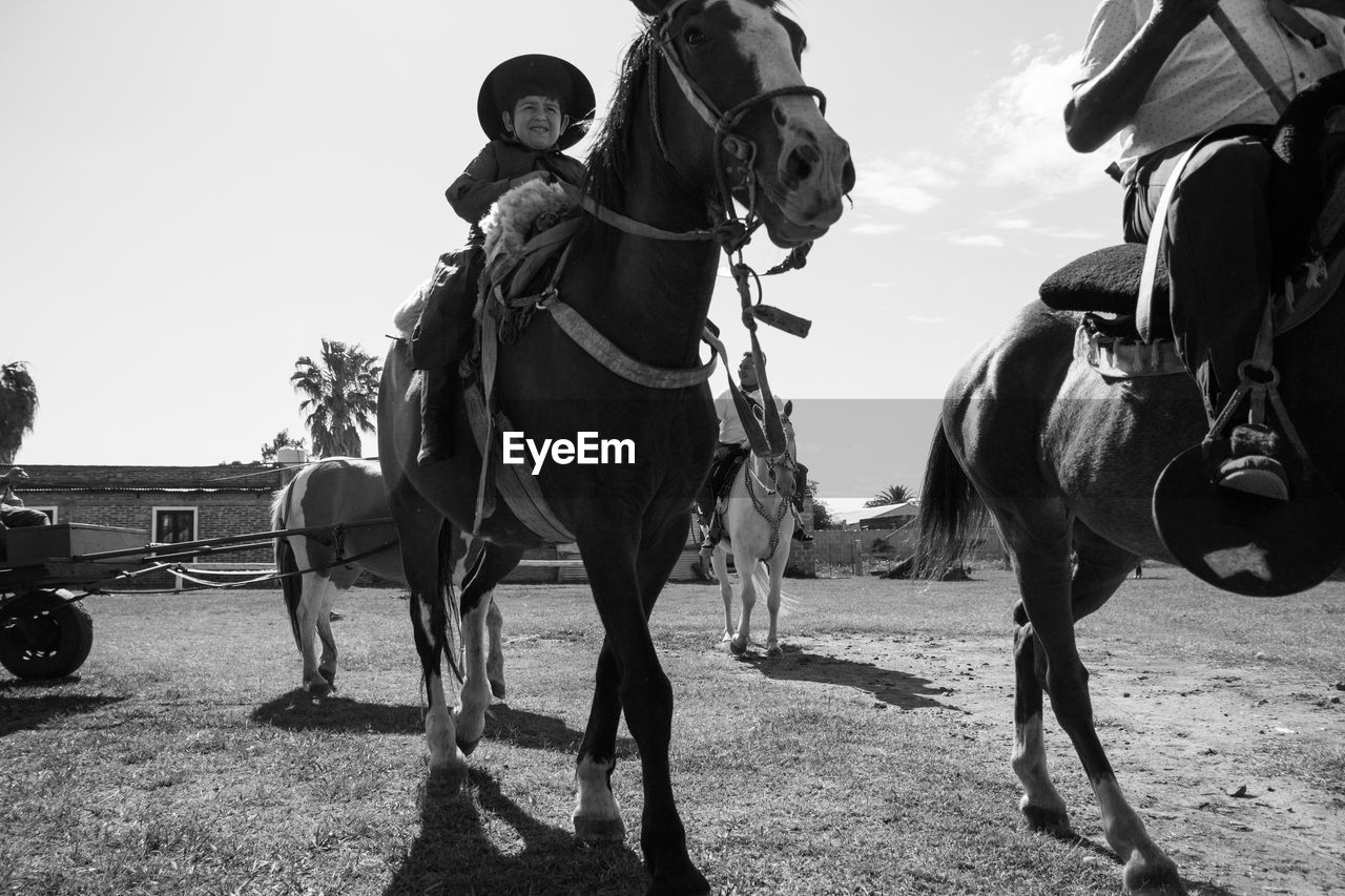 People riding horses in south america