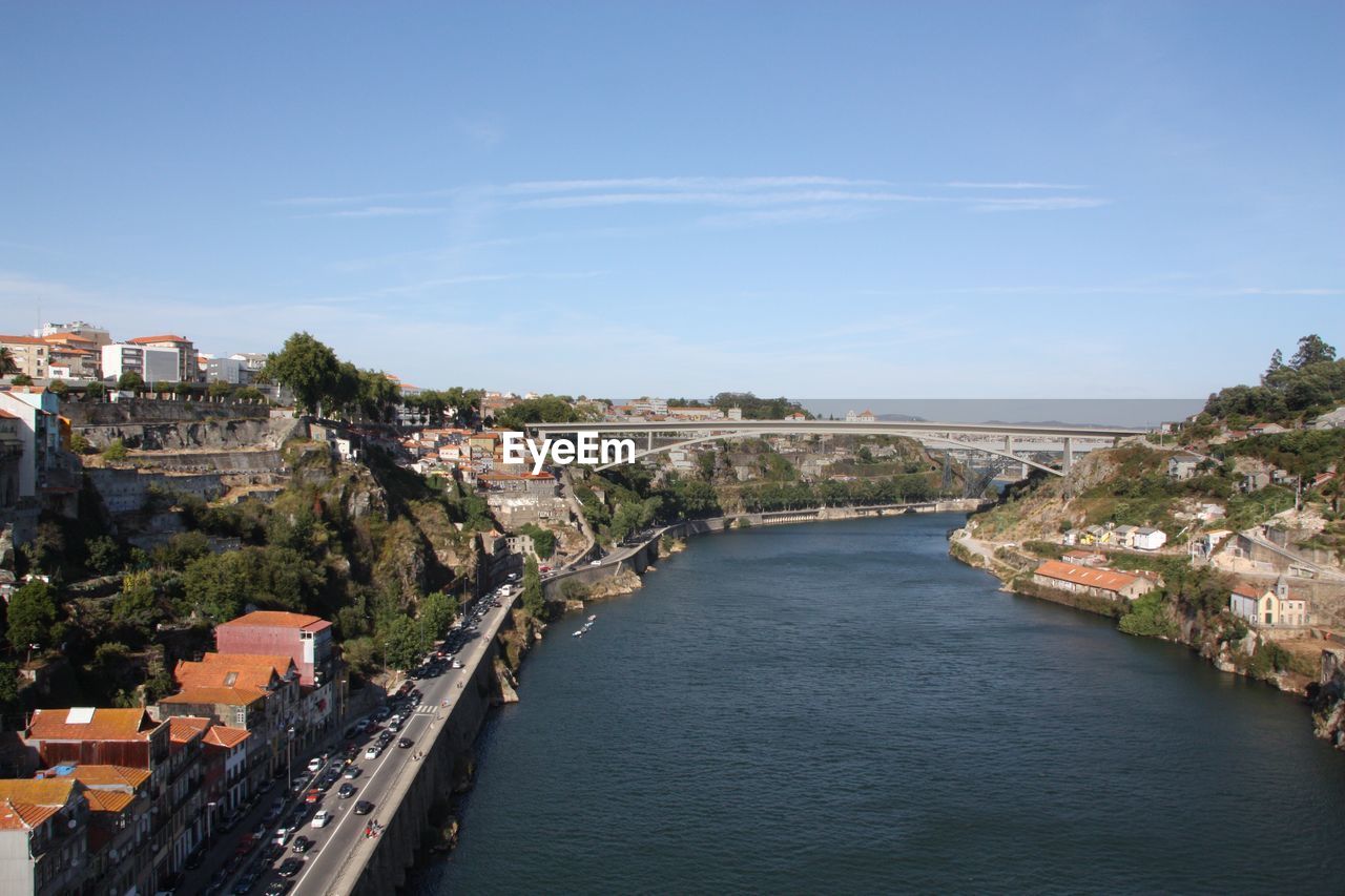 VIEW OF RIVER AMIDST BUILDINGS IN TOWN