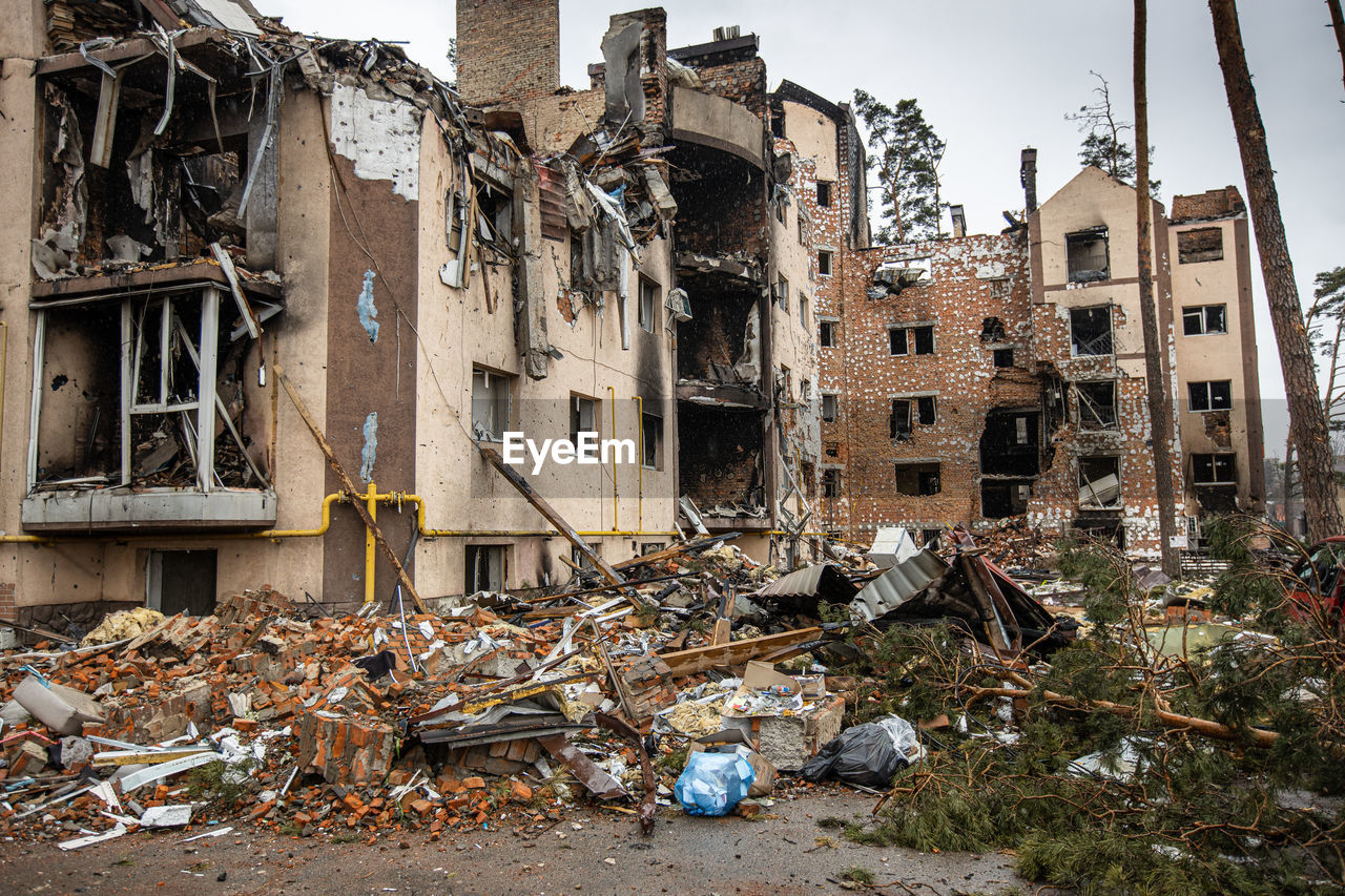 Destroyed buildings on the streets of irpen. broken, shelled windows.