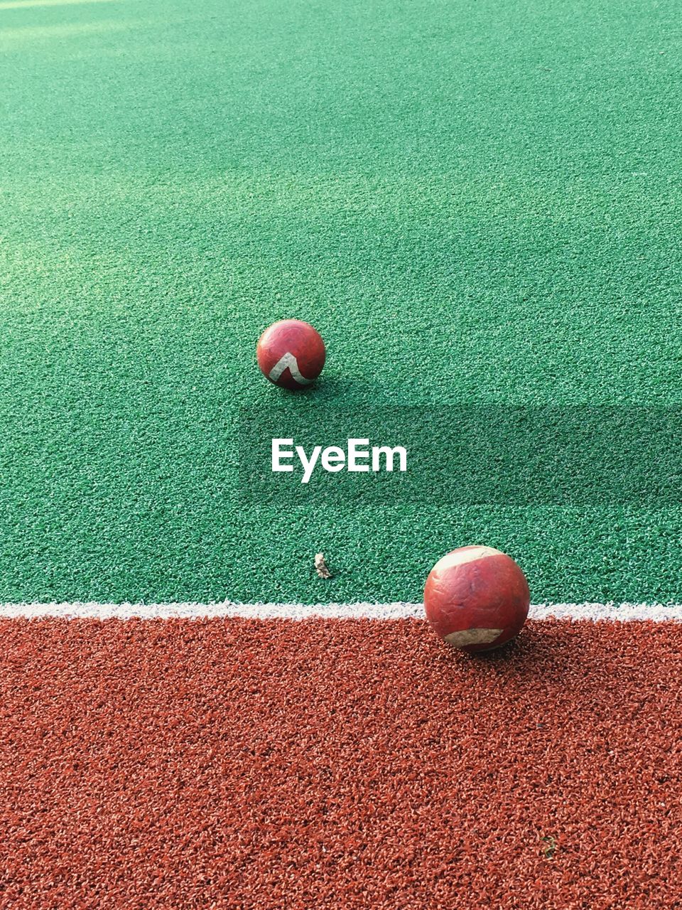 CLOSE-UP OF RED BALL ON TABLE AT HOME