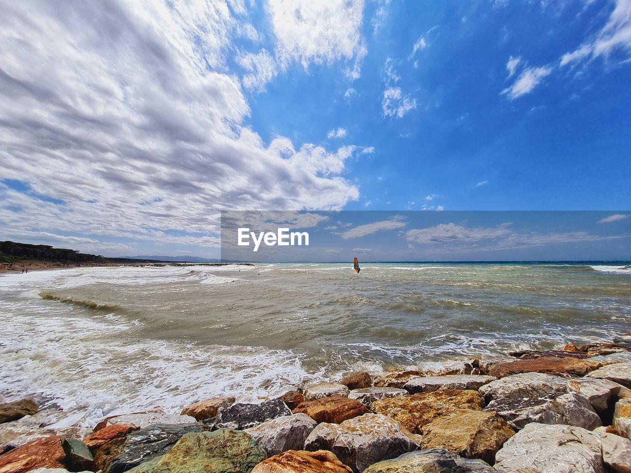 Windsurf suspended between sea and sky