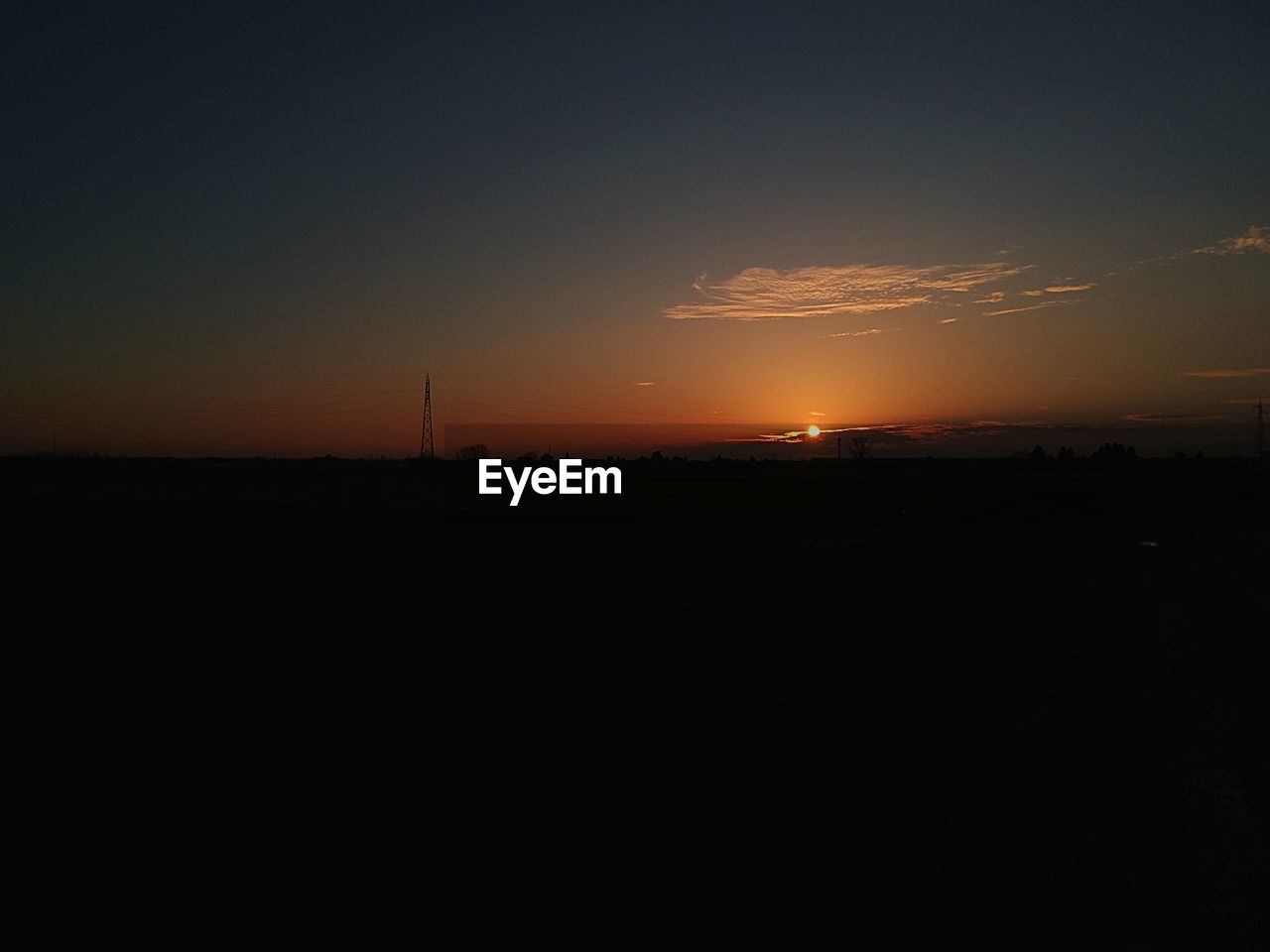 SILHOUETTE LANDSCAPE AGAINST SKY AT SUNSET