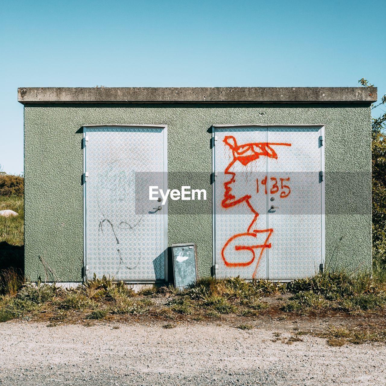 Graffiti on wall against clear sky