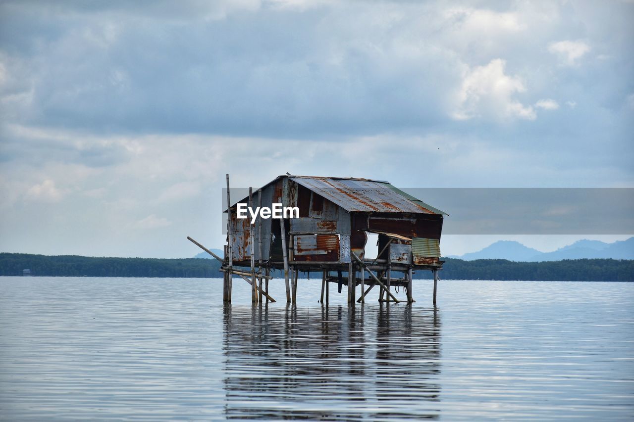 House on sea against sky