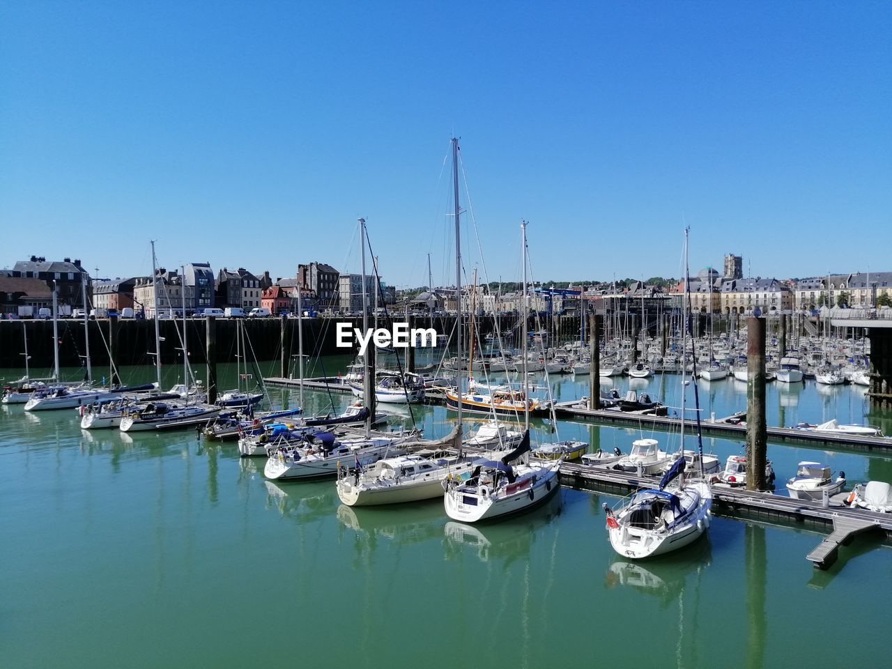 BOATS MOORED IN HARBOR