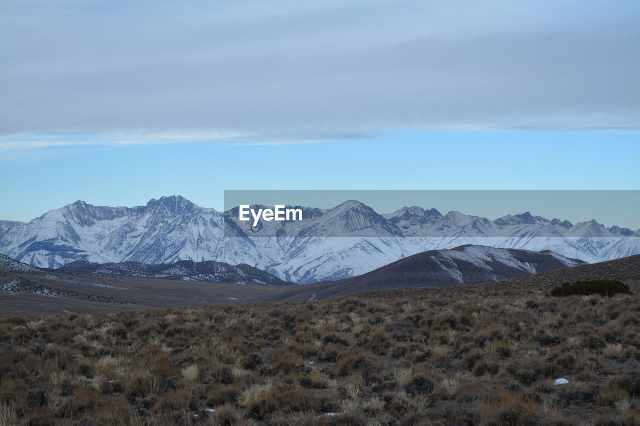 Scenic view of snowcapped mountains against sky