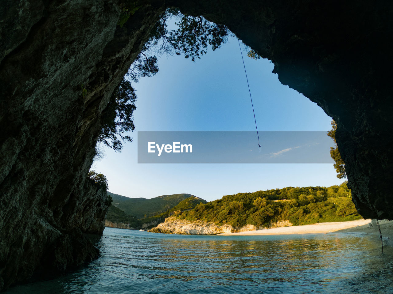 SCENIC VIEW OF SEA AND ROCKS AGAINST SKY