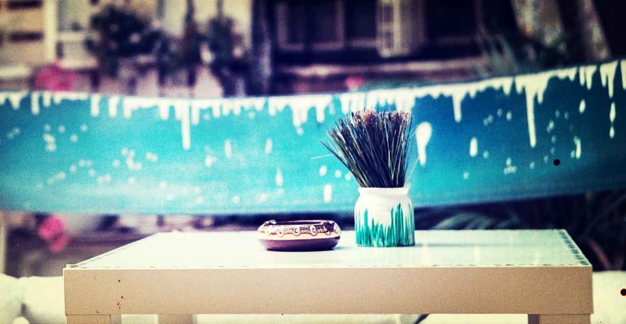 Joss sticks in an incense pot outdoors