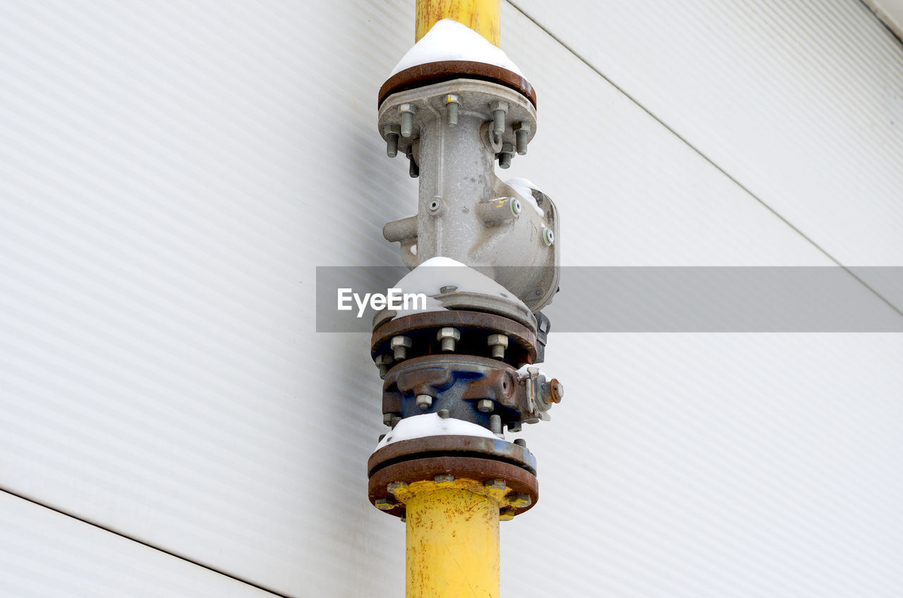 LOW ANGLE VIEW OF ELECTRIC LAMP AGAINST SKY