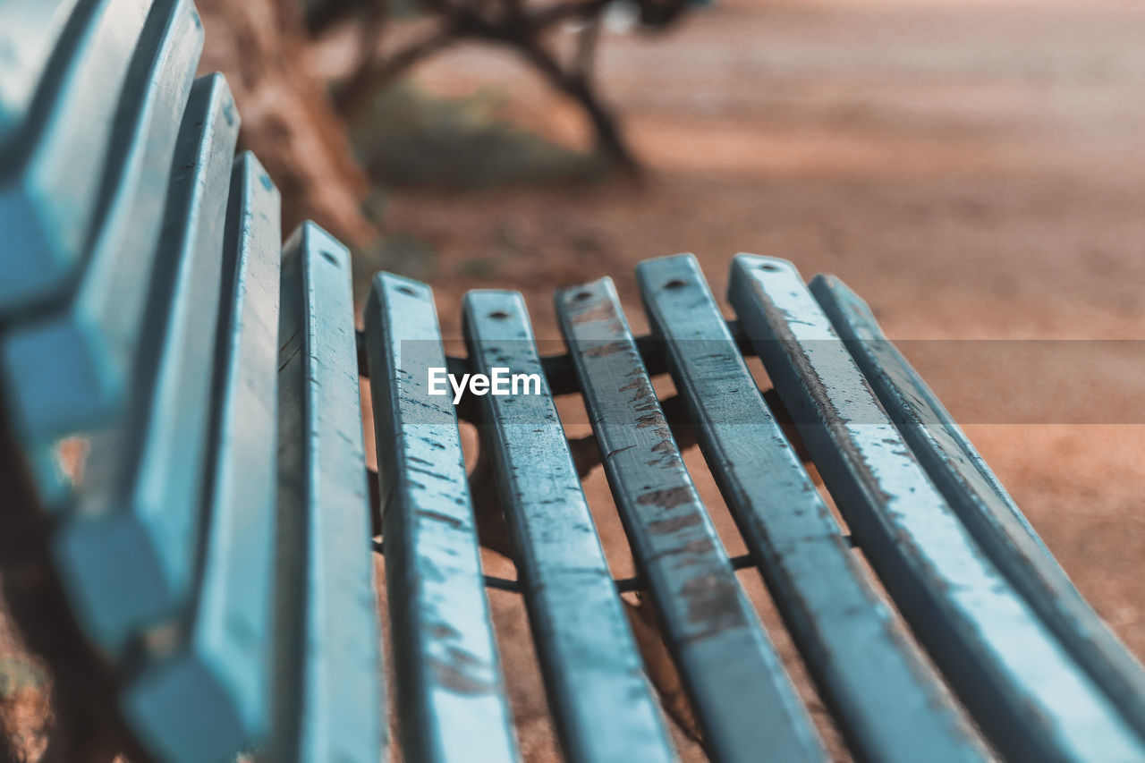 Close-up of bench in park