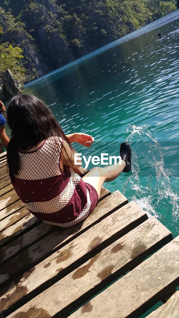 WOMAN RELAXING ON BEACH