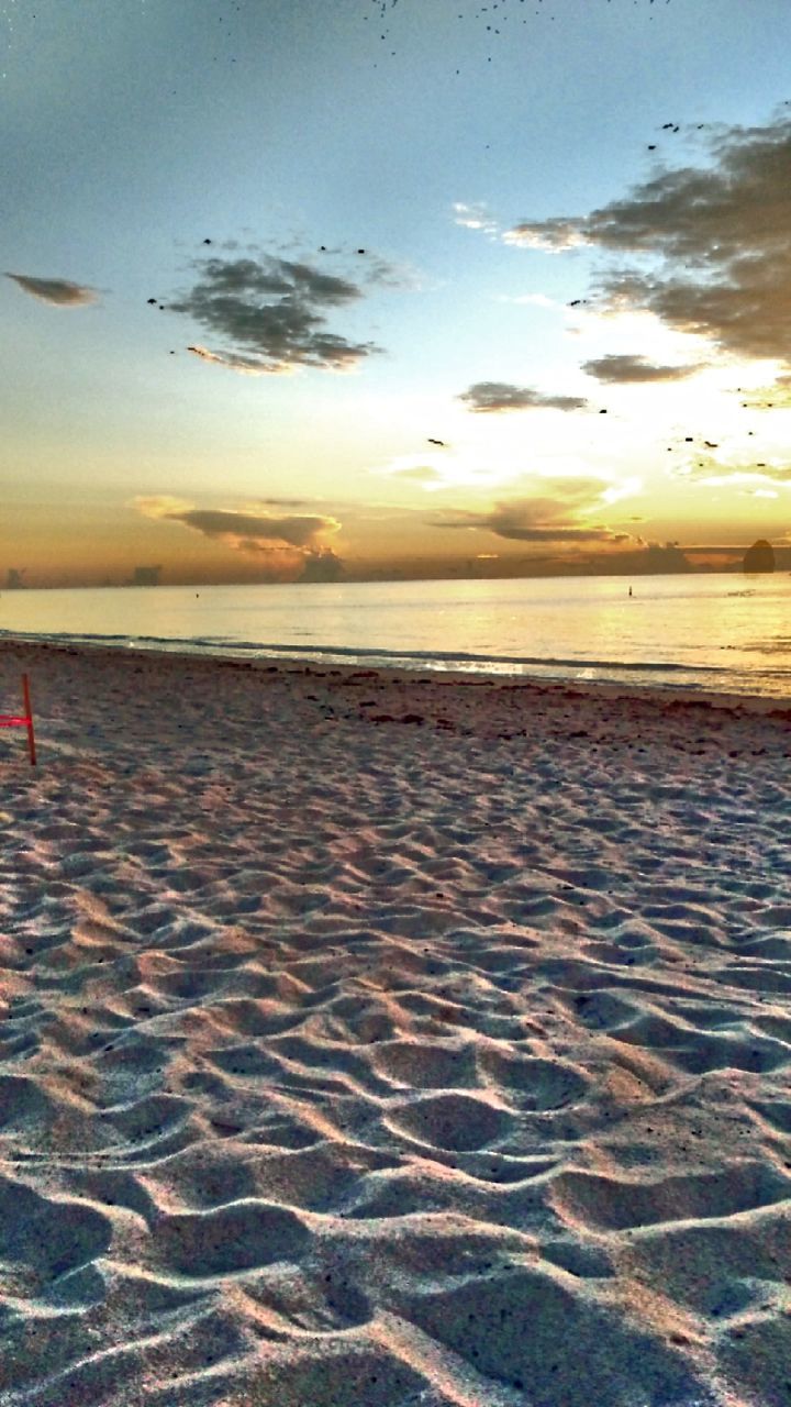 Scenic view of sea at sunset