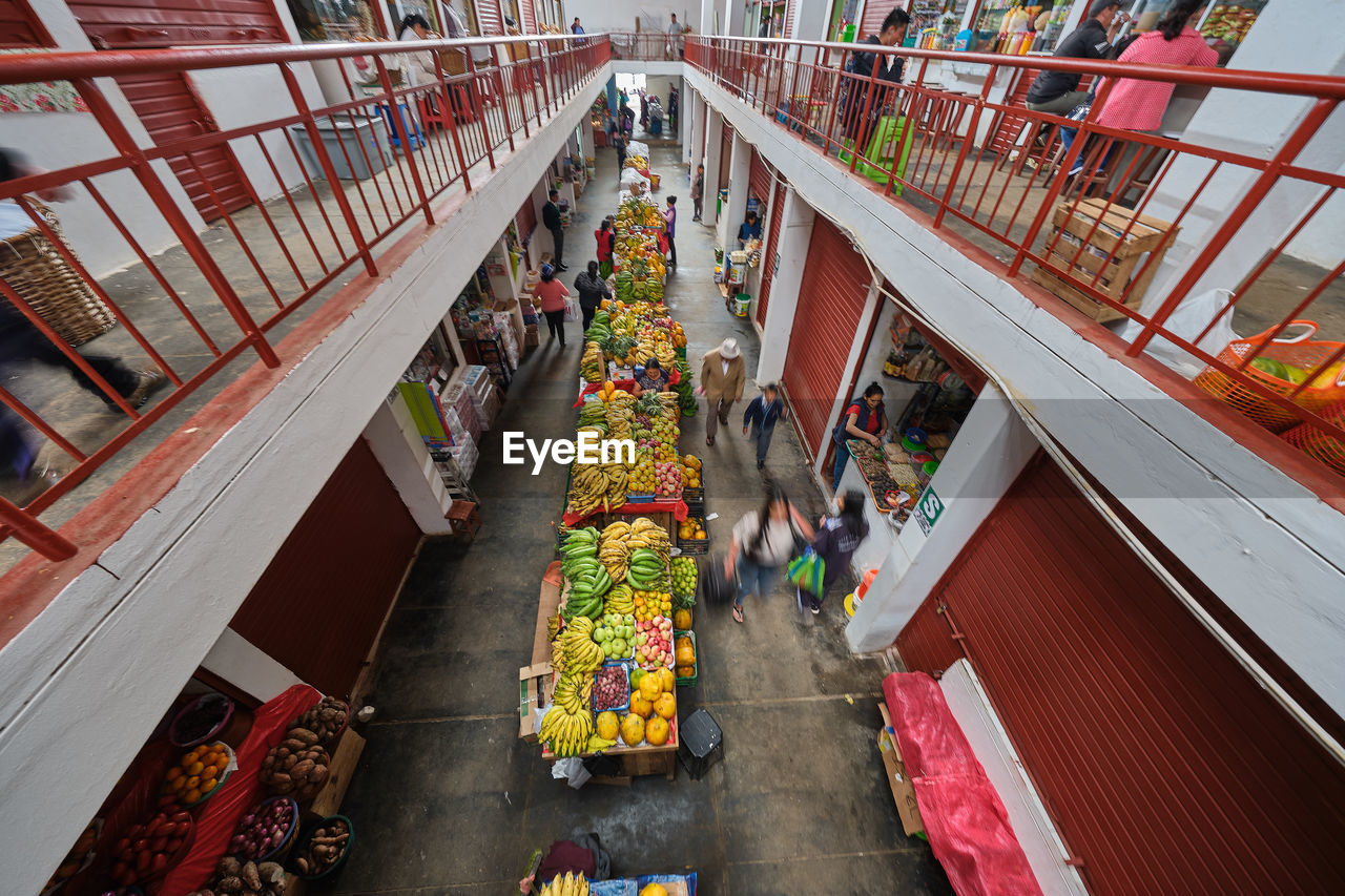 High angle view of people on footbridge in city