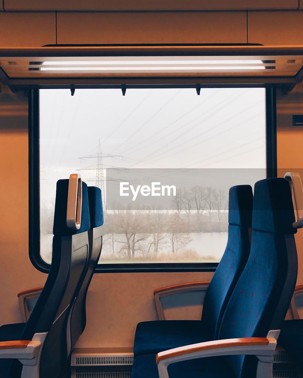 Empty chairs in train during winter
