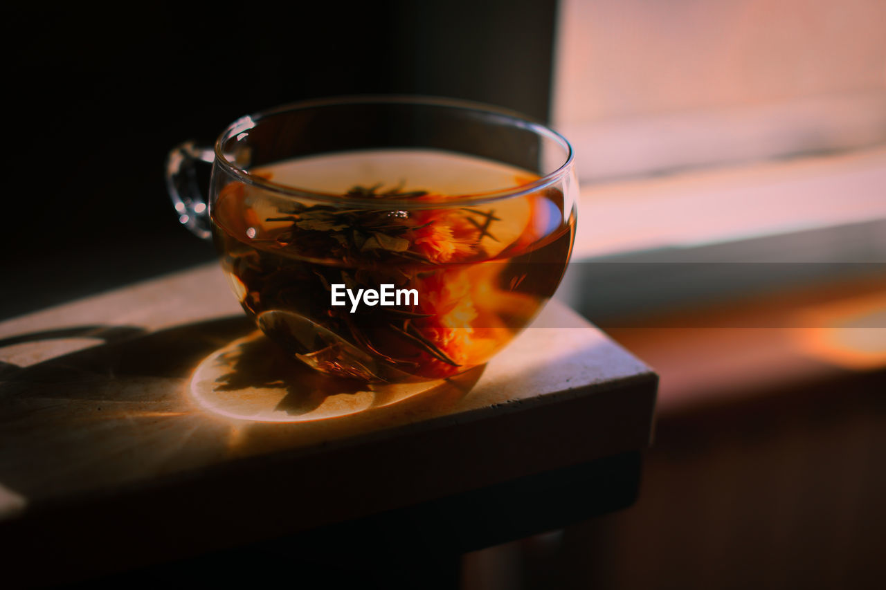 Close-up of herbal tea in cup on table