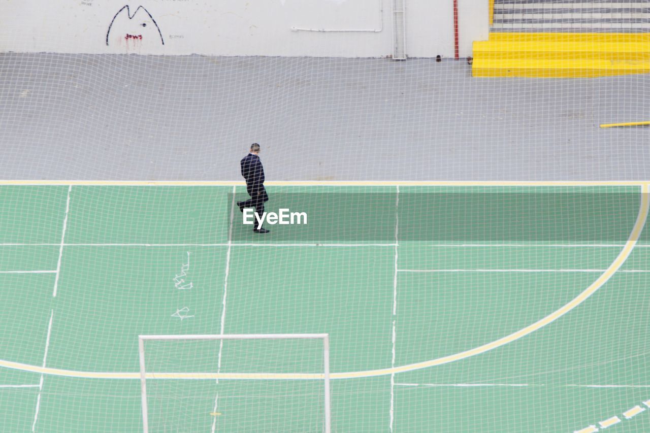 High angle view of man on sports court