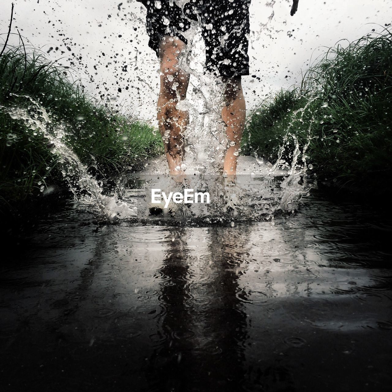 Person splashing in stream