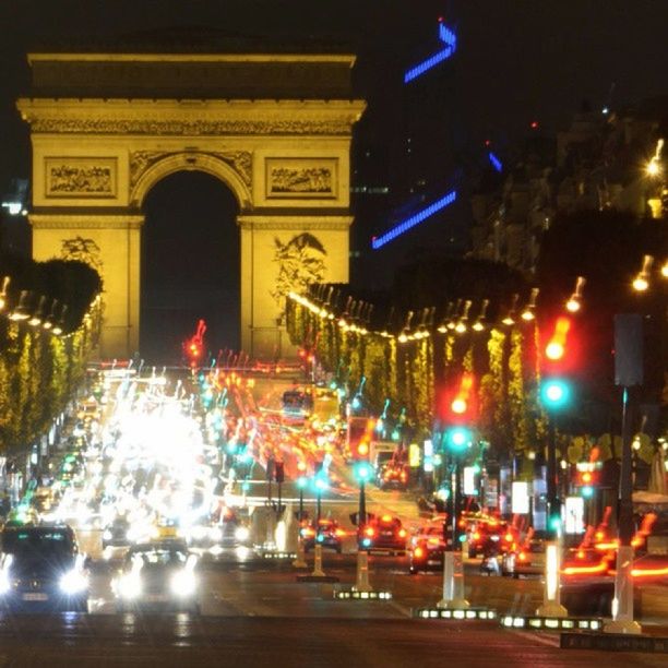 VIEW OF ILLUMINATED CITY AT NIGHT