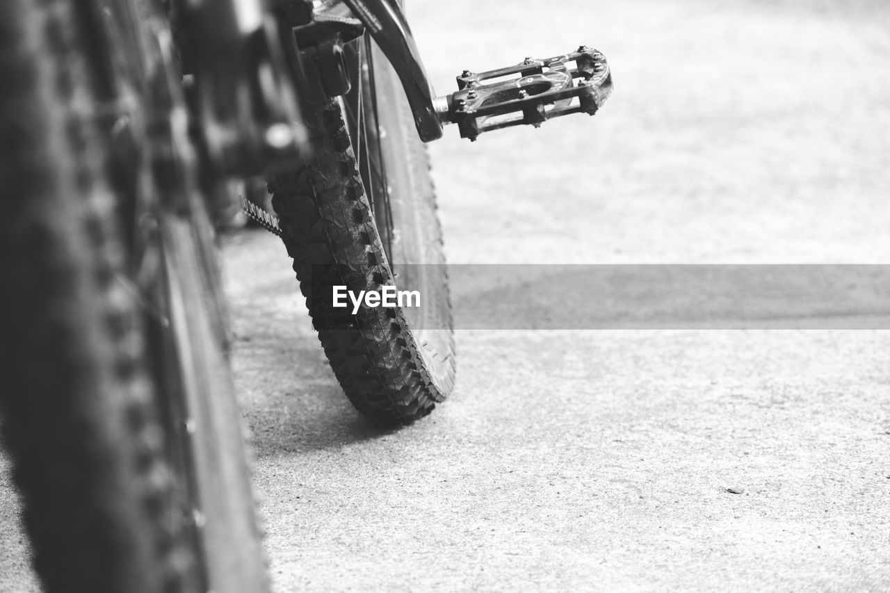 Close-up of bicycle on road