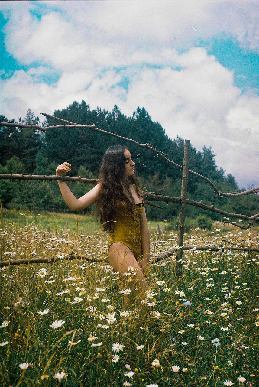 Woman posing in field